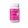 Biotin supplement bottle with pink label on a white background